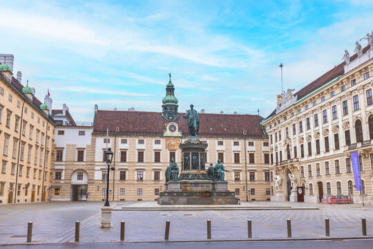Inner courtyard of Hofburg Palace with Emperor Franz I monument in Vienna.