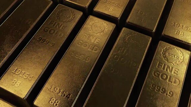 Cinematic overhead view of pure gold bars as a symbol of luxury, success, and heavy commodity assets.
