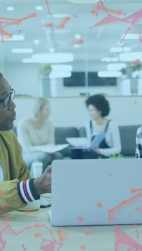 Vertical video: Laptop user gesturing, speaking for work while team reading docs after phone glance