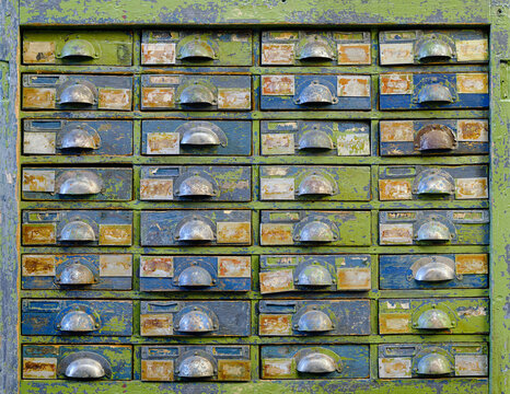 Very old wooden cabinet with multiple drawers - cards, files, tools or fasteners storage unit