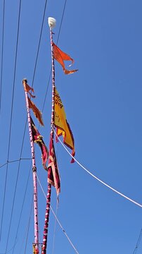 The Sasan Kathi is a ceremonial victory staff for Lord Jyotiba in Kolhapur. Devotees dance with these 70ft poles during the Chaitra Yatra, chanting "Changbhala" amidst clouds of pink gulal powder.