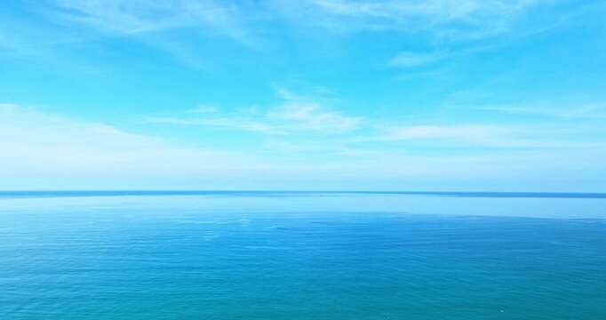 Aerial view of blue sky and Emerald Sea
Soft daylight filters through a thick veil of clouds, revealing intricate patterns stretching across the sky. Atmospheric Tranquility.The scene balances a calm