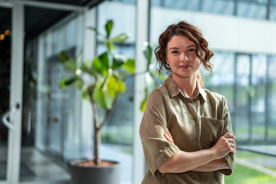 Businesswoman posing with confidence in modern office environment