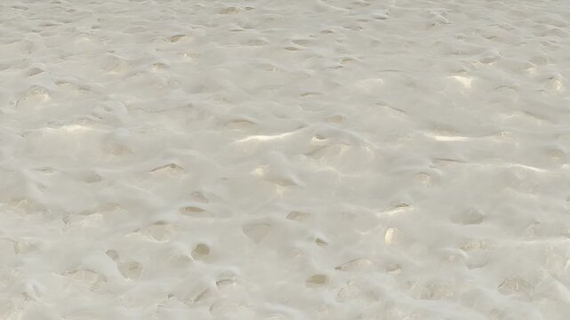 Closeup of sand on the beach.