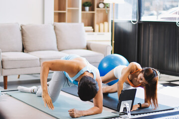Naklejka premium Support, teamwork and fitness couple doing workout training, challenging exercise for endurance, strength and stamina in a gym. Active, fit man and woman giving support and motivation during pushup
