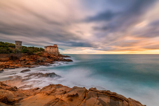 Boccale castle and the sandstone rocks of Romito during a storm at sunset. Livorno, Tuscany region, Italy, Europe