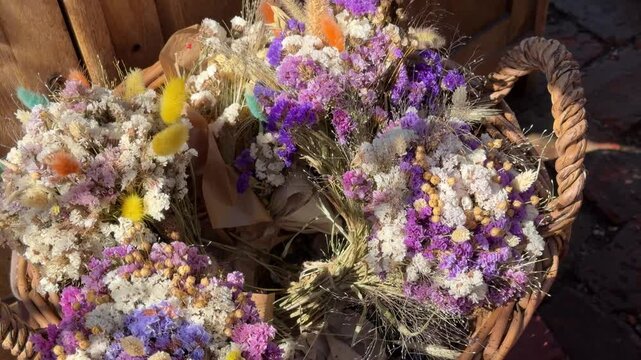 Dried statice and lagurus ovatus flowers in a basket