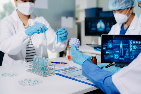 Scientists conducting laboratory research, analyzing samples in a biotech lab. Healthcare innovation, medical testing, and advanced science technology