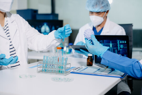 Scientists conducting laboratory research, analyzing samples in a biotech lab. Healthcare innovation, medical testing, and advanced science technology