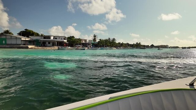 Sailing towards Caribbean coastline bright daylight, Los Roques