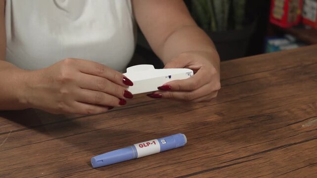 Female preparing Semaglutide GLP-1 pen for self-administered injection at home, obesity treatment