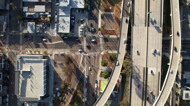 Drone flying north at 6PM with camera facing down and tilting up to reveal a closer view of the downtown San Diego skyline.