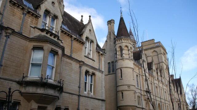 Oxford university college building with gothi architecture and spire in england
