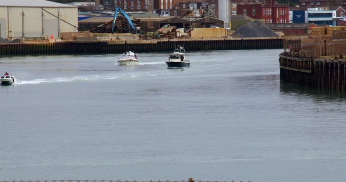 Shot of Three boats leaving Shoreham Harbour