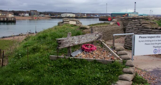 Wide panning shot right to left of the entrance to a War Memorial set up as a World War One trench. At Shoreham Fort