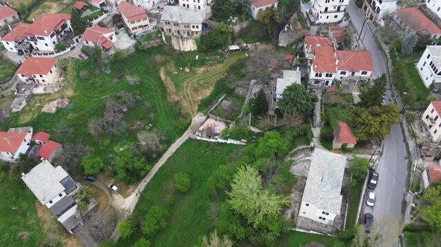 Aerial view of Portaria traditional village on Mount Pelion, Greece, with stone houses and lush green landscape