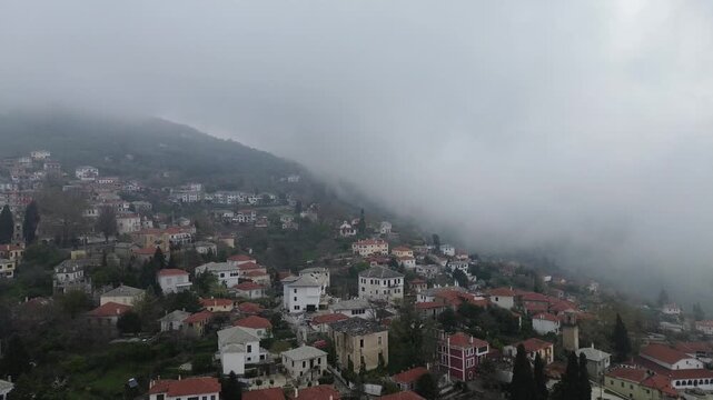 Aerial view of Portaria traditional village on Mount Pelion, Greece, with stone houses and lush green landscape