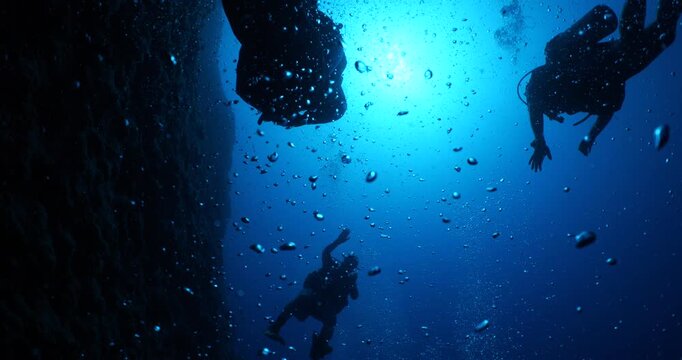 air bubbles slow  underwater coming up scenery dark blue and sun shine ocean scenery from scuba  divers backgrounds