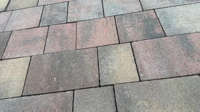 Stone patio tiles arranged in pattern
