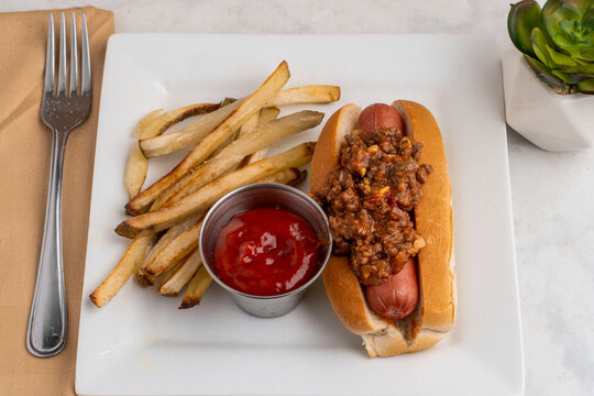 hot dog top with sloppy joe  served with french fries