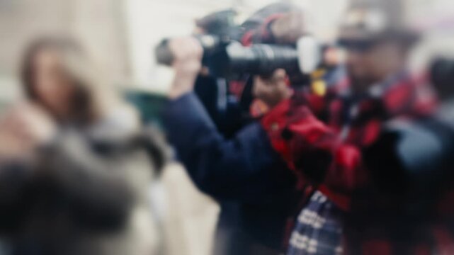 Photographers and paparazzi taking pictures at an event