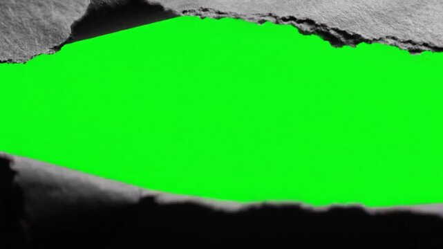 Torn paper with green background exposed.