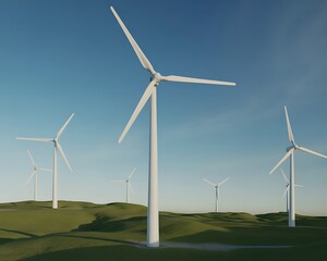 Fototapeta premium Wind turbines in a green landscape under a blue sky