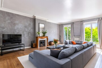 Naklejka premium Spacious modern living room interior with contemporary decor