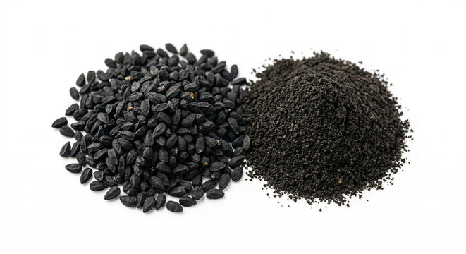 Black cumin seeds and ground powder on white surface
