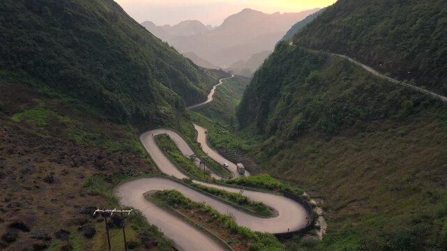 Aerial View Of the Winding Tham Ma Mountain Pass In Ha Giang Province In Vietnam - Ha Giang Loop Drone Shot at Sunset.