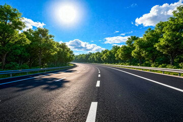Fototapeta premium Asphalt Highway with Green Trees and Blue Sky