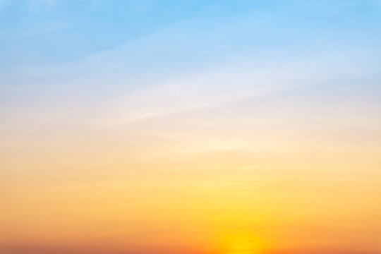 Beautiful luxury soft gradient with orange gold clouds and sunlight on the blue sky perfect for the background, take in everning,morning,Twilight, high definition landscape photo