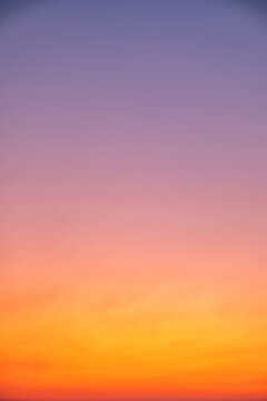 Beautiful luxury soft gradient with orange gold clouds and sunlight on the blue sky perfect for the background, take in everning,morning,Twilight, high definition landscape photo, Vertical