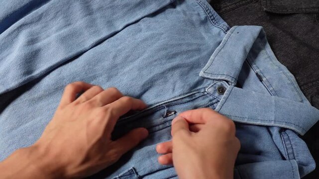 Hand buttoning denim cloth