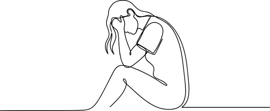 Sad woman sitting alone crying.