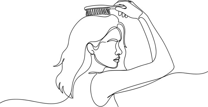 Woman combing her long hair.
