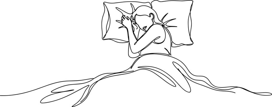 Woman sitting on bed with pillow.