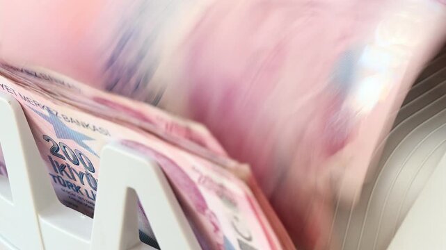Turkish money counted by machine. Banknotes of 200 liras. Financial business concept. Close up
