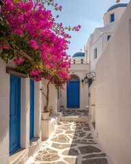 Fototapeta premium Mediterranean street with white facades and colorful blooms, showcasing tourism, architecture and serene atmosphere