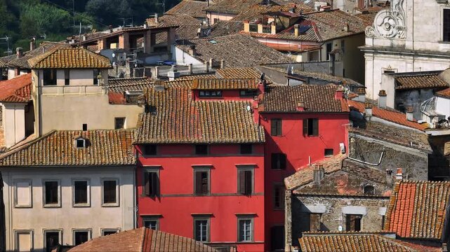Detailed aerial view Orte Italy historic old town architecture pattern traditional stone buildings red facade terracotta tile roofs summer daylight summer travel destination heritage.
