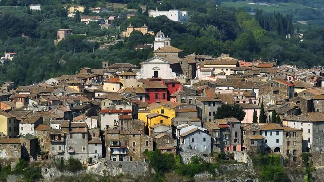 Detailed aerial view Orte Italy medieval city old town cathedral pattern traditional stone architecture summer daylight travel tourism destination Lazio landmark.