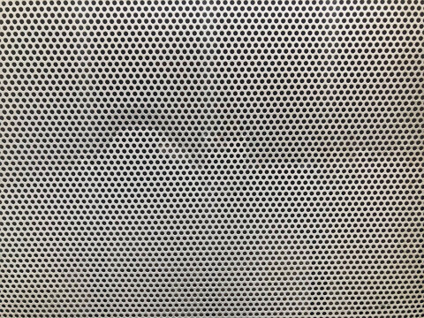 Seamless perforated metal sheet texture background