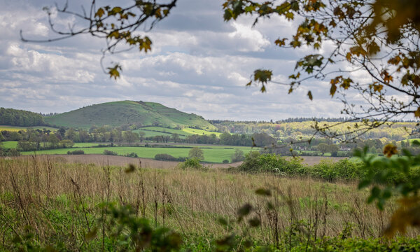 Framed landscape view across the valley to Cley Hill at spring time in Wiltshire, UK