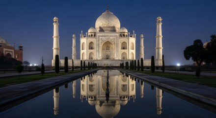 Naklejka premium Taj Mahal at Sunrise with Reflection in Water Channel