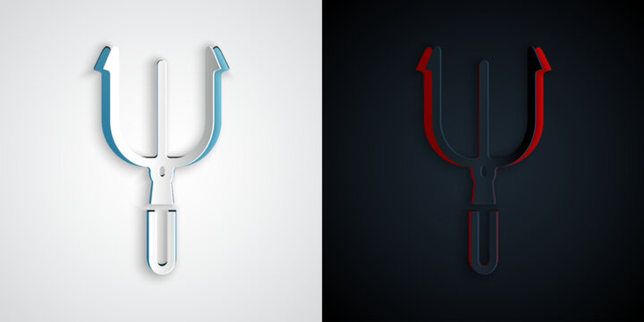 Paper cut Neptune Trident icon isolated on grey and black background. Paper art style. Vector