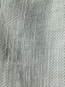 Textura de tela tejida de color gris con patr&oacute;n de tramado irregular