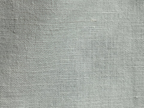 Textura de tela de lino en color gris claro con trama de tejido natural detallada