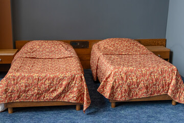 A room in the Kosmos Hotel, built for the Olympic Games-80 in Moscow. A historic room with a view of the VDNKh at the Kosmos Hotel. Retro interior in the hotel. Beds in the Cosmos Hotel room.