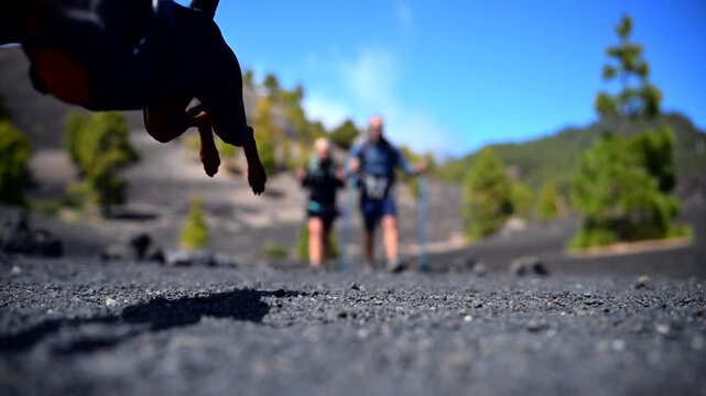 Couple and Dog Hiking the Ruta de los Volcanes in La Palma; Active Lifestyle and Pet-Friendly Travel Canary Islands; Adventure Trekking on Volcanic Ridge with Pet