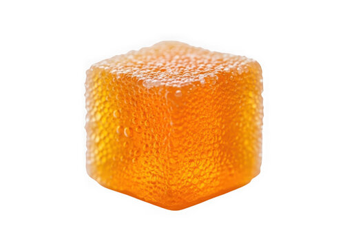 A cube of orange candy isolated on transparent background